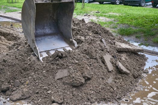 a wheeled machine for leveling the ground, especially in making roads