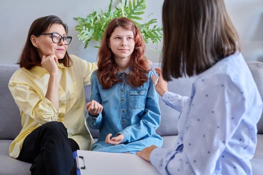 Child psychologist session, mother preteen daughter and behaviour therapist together in office. Professional help, mental health, behaviour correction, counseling, psychology therapy, children family