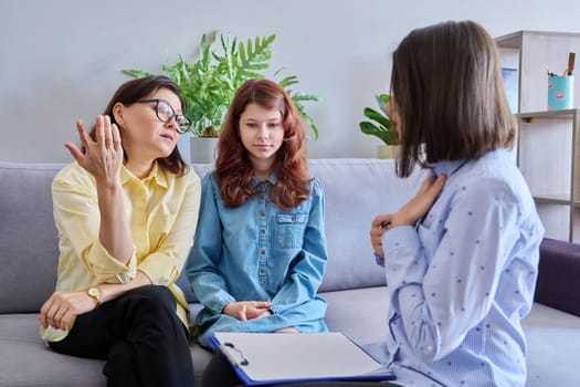Child psychologist session, mother preteen daughter and behaviour therapist together in office. Professional help, mental health, behaviour correction, counseling, psychology therapy, children family