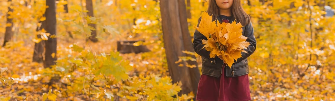 Autumn portrait of cute little asian girl copy space. Children, fall and season concept