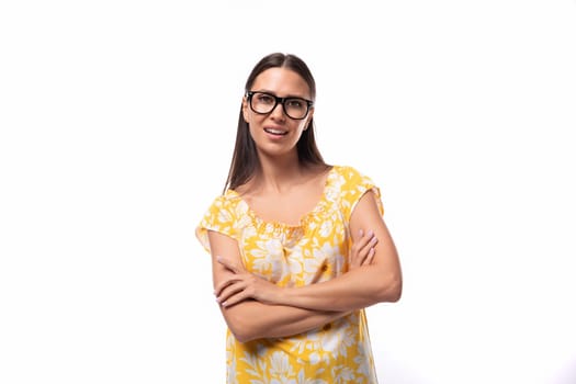 portrait of a slender young woman with glasses for vision correction on a white background.