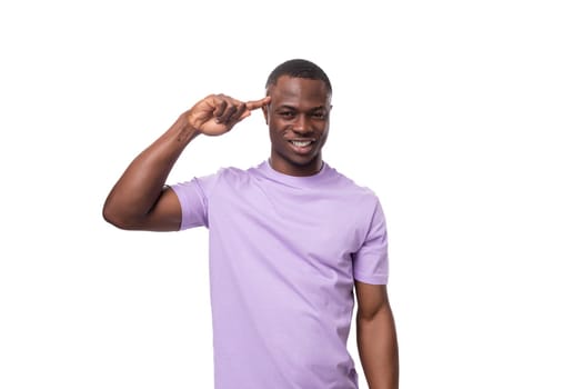 young smart handsome african man in lilac t-shirt thought.