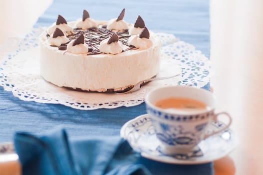 Barbecue ash cake on coffee table on cake plate