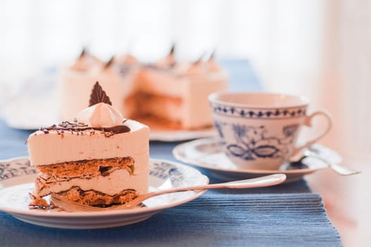 Grilled ash cake piece on porcelain plate