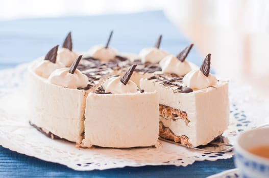 Barbecue ash cake on coffee table on cake plate