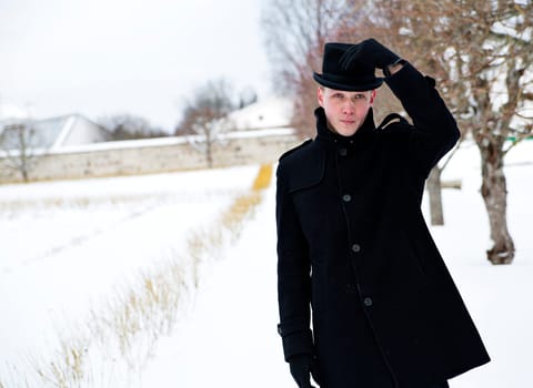 Young man put hat back on his head