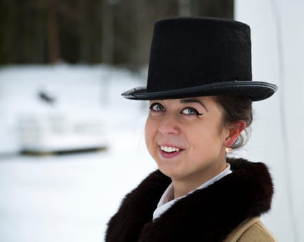 Cool portrait of smiling young woman with hat