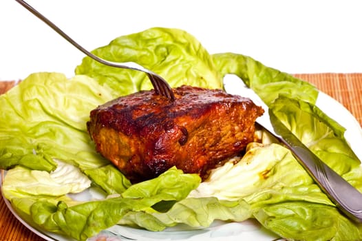 Roast with vegetables on a white background