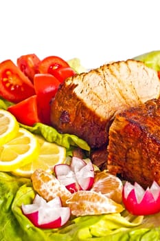 Roast with vegetables on a white background
