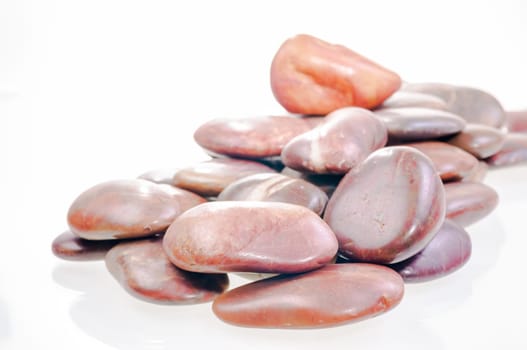 A heap of red river zen stones close up