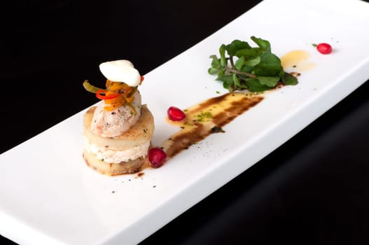 Fish rillettes amuse bouche with pomegranate and fresh basil