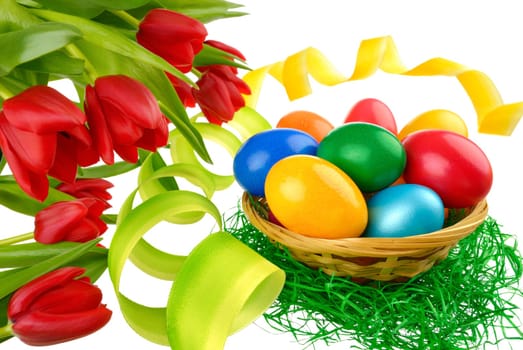 Easter decoration with eggs,tulips and ribbon on white background