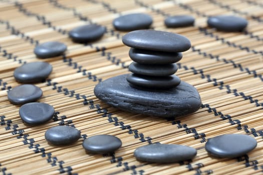 Details of a tranquil scene, made of black pebbles in balance