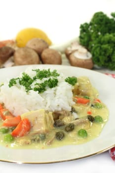a plate of rice and colorful chicken fricassee