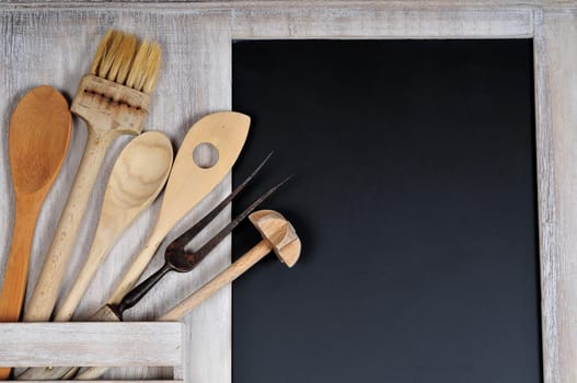 old wooden wooden spoon and a blackboard