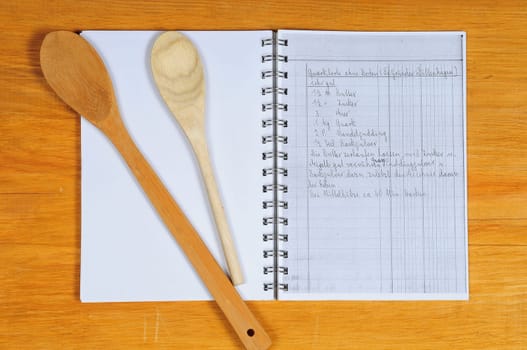 Cookbook and old wooden wooden spoon