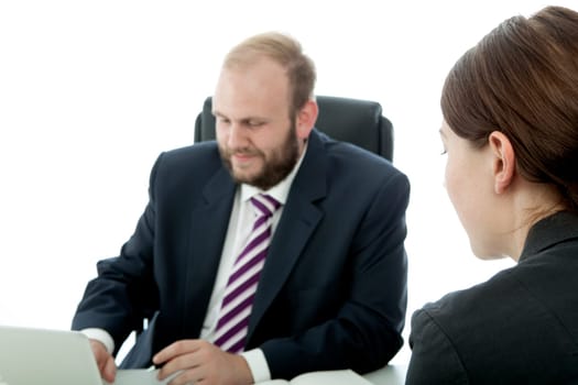 beard business man brunette woman at desk
