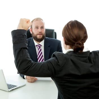 beard business man brunette woman at desk arms in the air