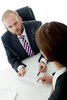 beard business man brunette woman at desk signs contract