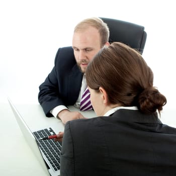 beard business man brunette woman at desk explain at laptop