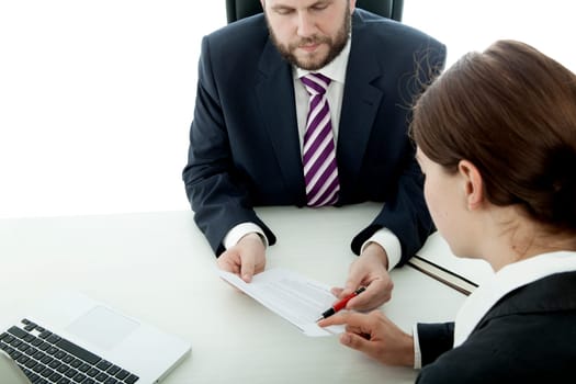 beard business man brunette woman at desk signing contract