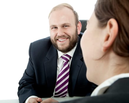 beard business man brunette woman at desk happy