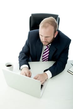 business man working desk with laptop