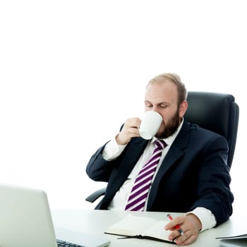 beard business man drink coffee while working computer