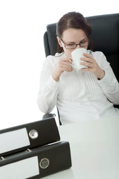 young brunette businesswoman with glasses relaxing and drinking coffee