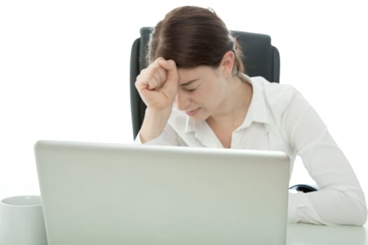 young brunette business woman is frustated behind laptop