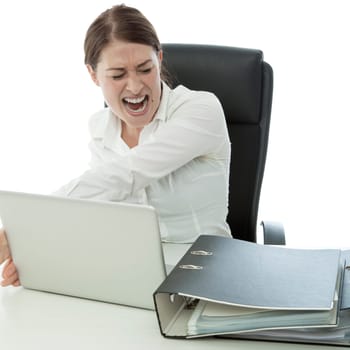 young brunette business woman in rage and throw laptop desk