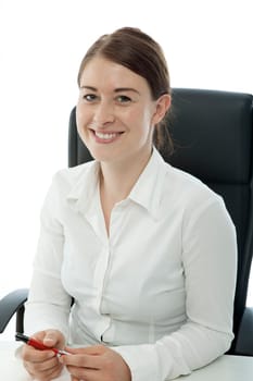 young beautiful brunette woman sitting in chair smiling