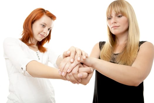 young beautiful red and blond haired girls in front of white background