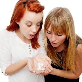 young beautiful red and blond haired girls in front of white background