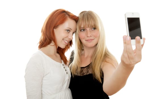 young beautiful red and blond haired girls in front of white background