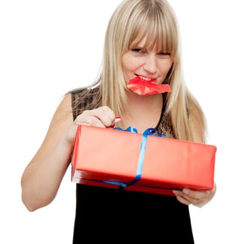 young beautiful blond haired girl open gift with mouth in front of white background