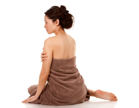 beautiful asian brunette nude on white isolated background