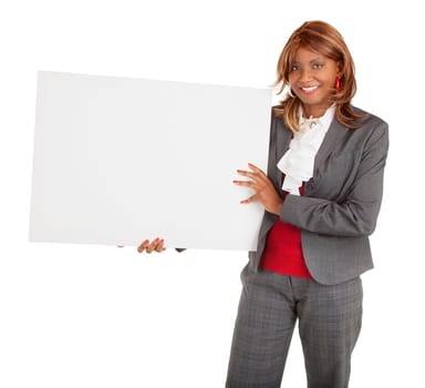 An african american woman is holding a blank white sign.