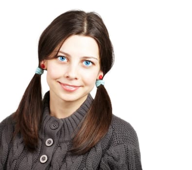 Portrait of a happy young brunette girl smiling.