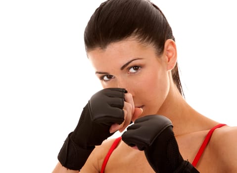 athletic brunette wearing boxing gloves on white isolated background