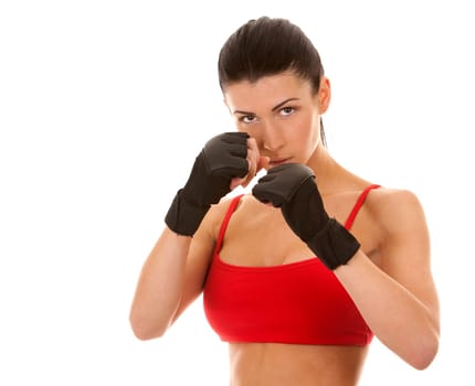 athletic brunette wearing boxing gloves on white isolated background