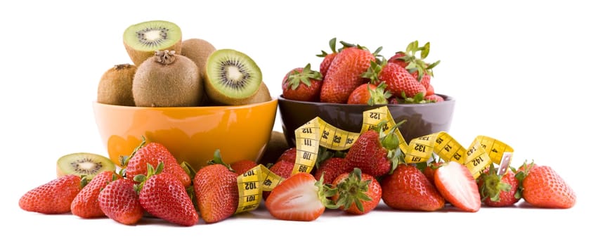 Strawberries and kiwi fruits with measure tape