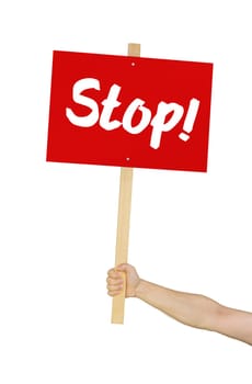 Person holding sign saying Stop