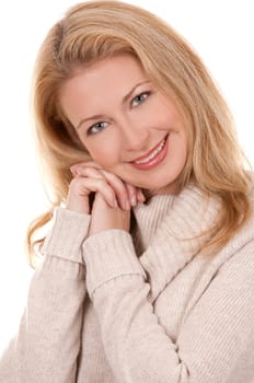 pretty blond woman wearing beige top sitting on white background