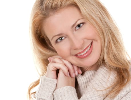 pretty blond woman wearing beige sweather on white background