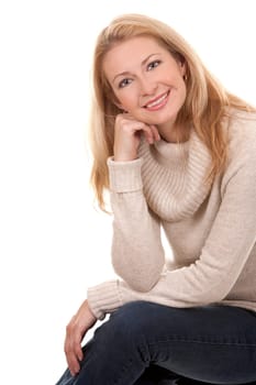 pretty blond woman wearing beige sweather on white background
