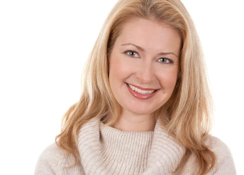 pretty blond woman wearing beige sweather on white background