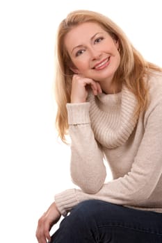 pretty blond woman wearing beige sweather on white background