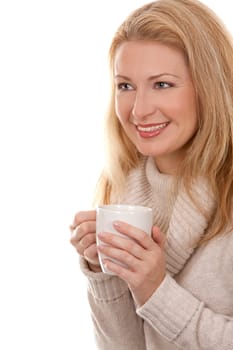 pretty blond woman wearing beige sweather drinking coffee