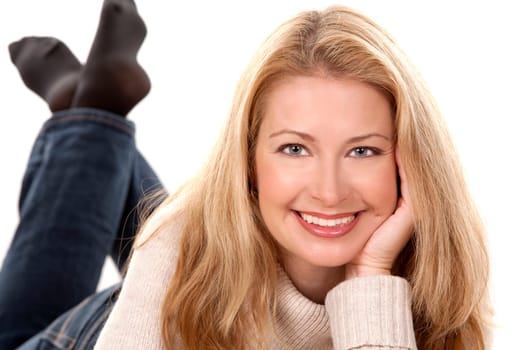 pretty blond woman wearing beige sweather on white background